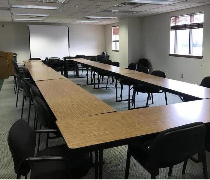Empty tables in rectangular shape in conference room,